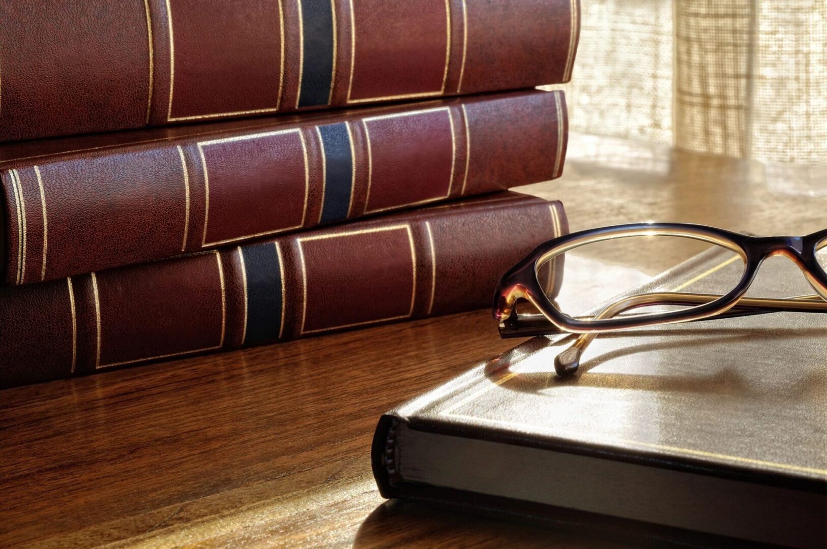 A book and glasses on the table