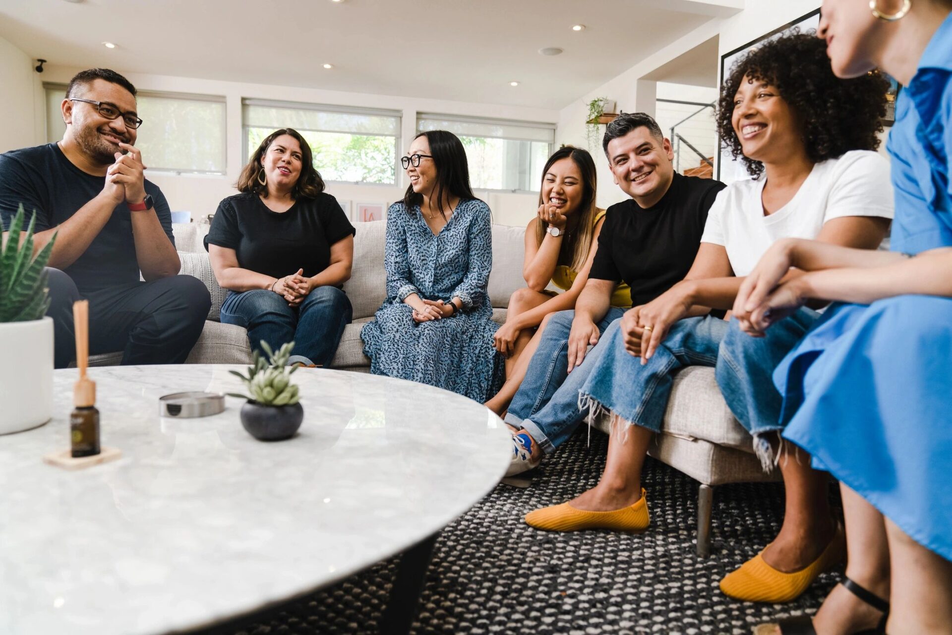 A group of people sitting around a table.