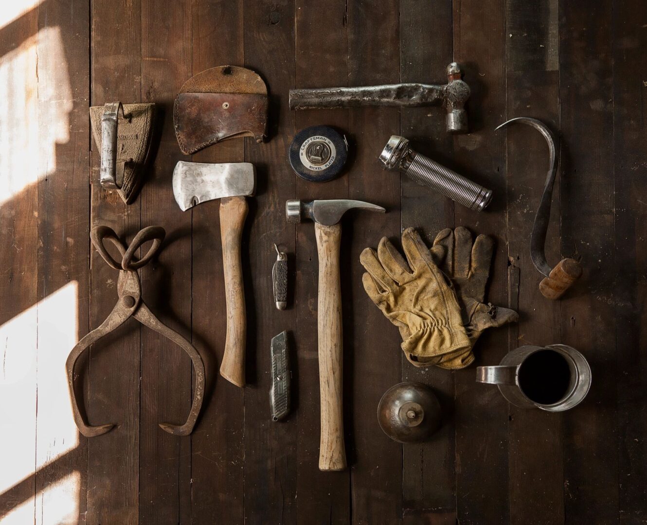 A wooden floor with many different tools on it