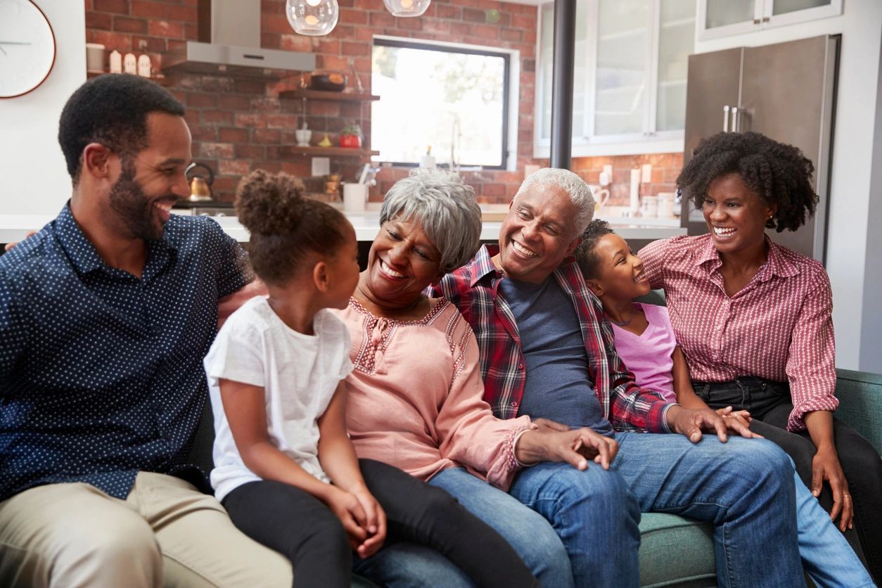 A group of people sitting on top of a couch.