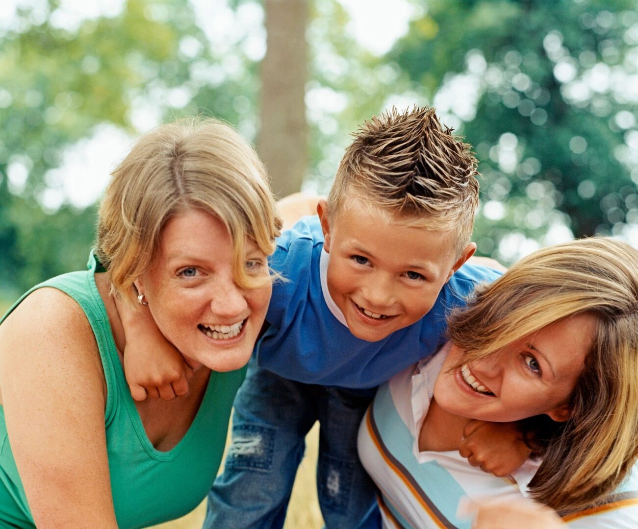 A group of people that are smiling for the camera