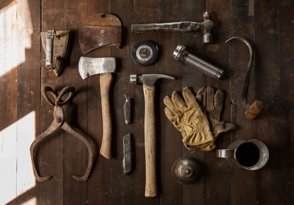A wooden floor with many different tools on it