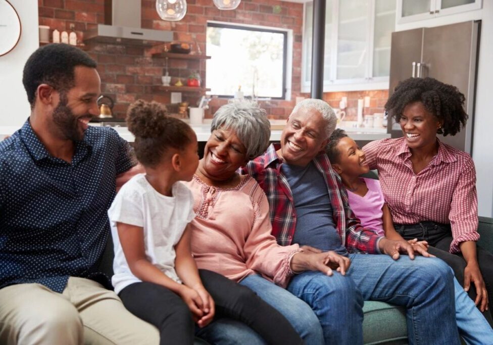 A group of people sitting on top of a couch.